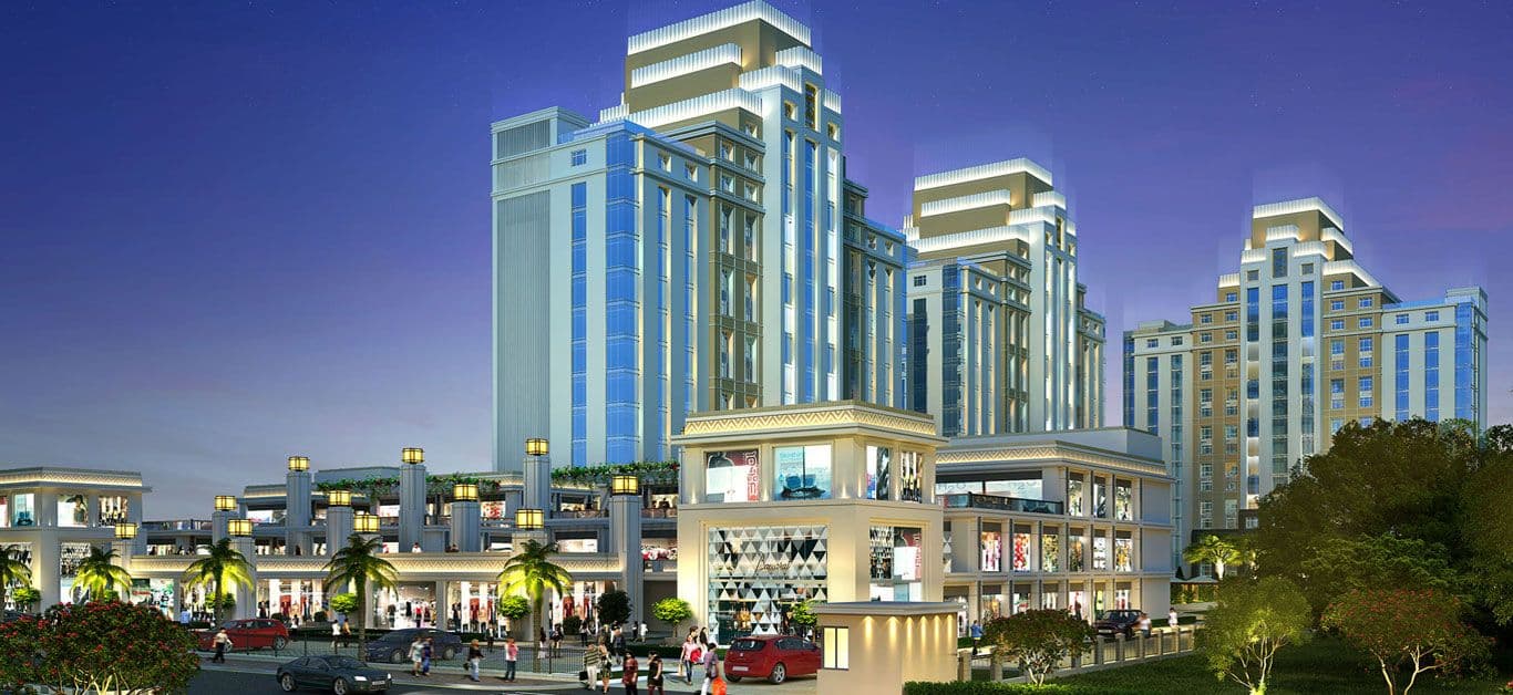Gurgaon International City commercial hub illuminated at night with retail and towers